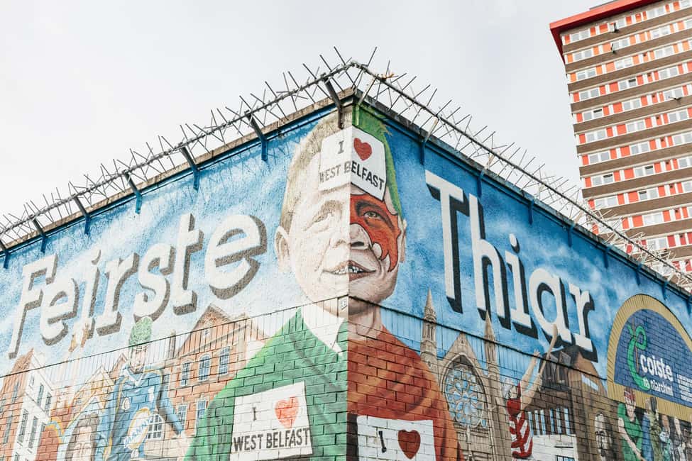 Belfast: The Troubles Walls & Bridges Guided Walking Tour - Walking toward Divis and the Falls area