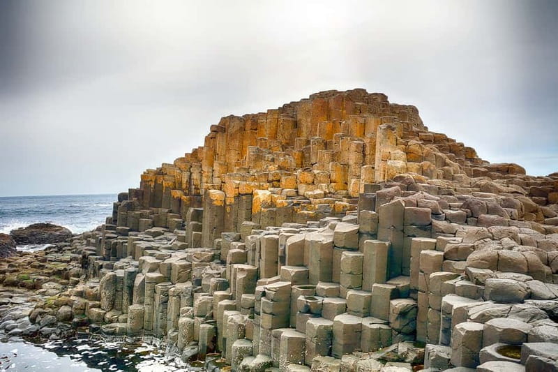 From Belfast: Giant's Causeway & Titanic Experience Belfast - Dunluce Castle views from the coach