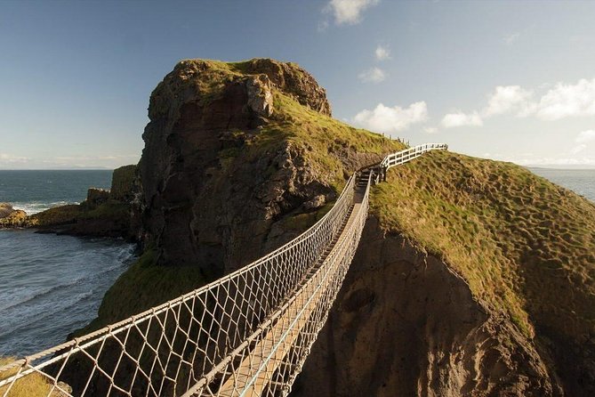 Giants Causeway & Game of Thrones Tour from Belfast - Dunluce Castle above the North Coast